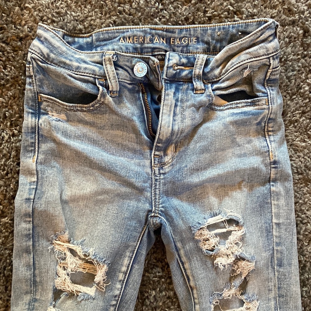 American Eagle light wash jeans with holes. Only worn a few times.